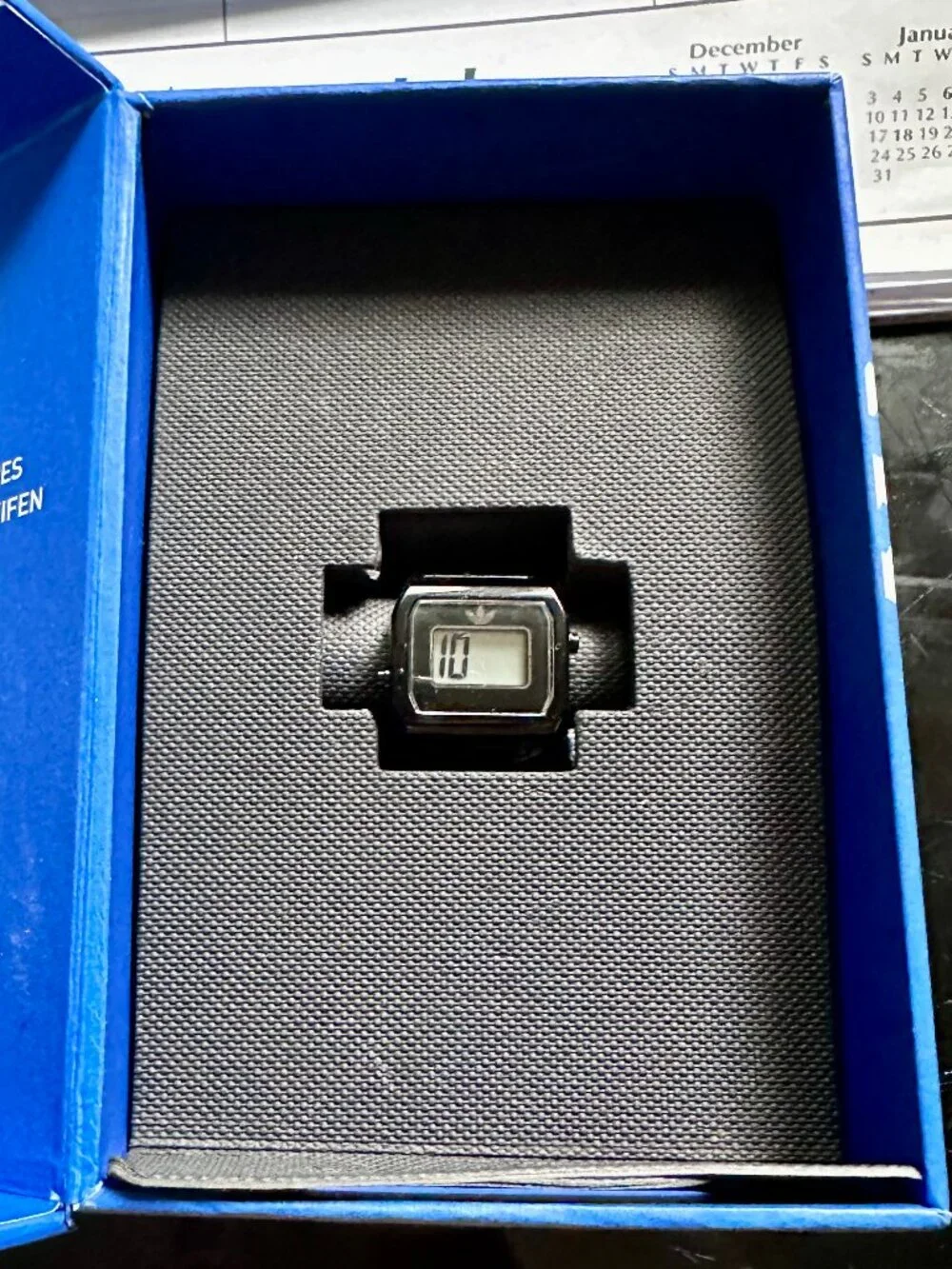 Black Adidas Originals digital two ring watch for finger